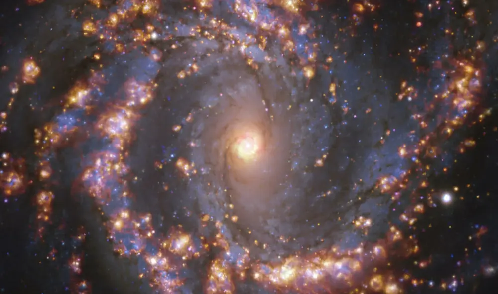 Imagen compuesta de la galaxia NGC 4303, situada a unos 55 millones de años luz, y detectada con el instrumento Muse del telescopio VLT. Foto: Handout European Southern Observatory/AFP Imagen compuesta de la galaxia NGC 4303, situada a unos 55 millones de años luz, y detectada con el instrumento Muse del telescopio VLT. Foto: Handout European Southern Observatory/AFP