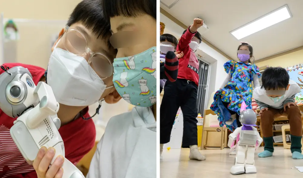 Los niños imitan los movimientos del robot Alpha Mini como parte de su educación creativa. Foto: Anthony Wallace / AFP
