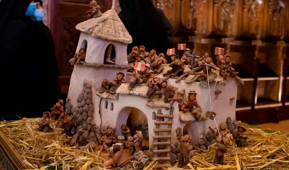 El nacimiento andino de barro muestra la labor de los hombres de Marcapata en Cusco. Foto: Consulado General del Perú en Turín El nacimiento andino de barro muestra la labor de los hombres de Marcapata en Cusco. Foto: Consulado General del Perú en Turín