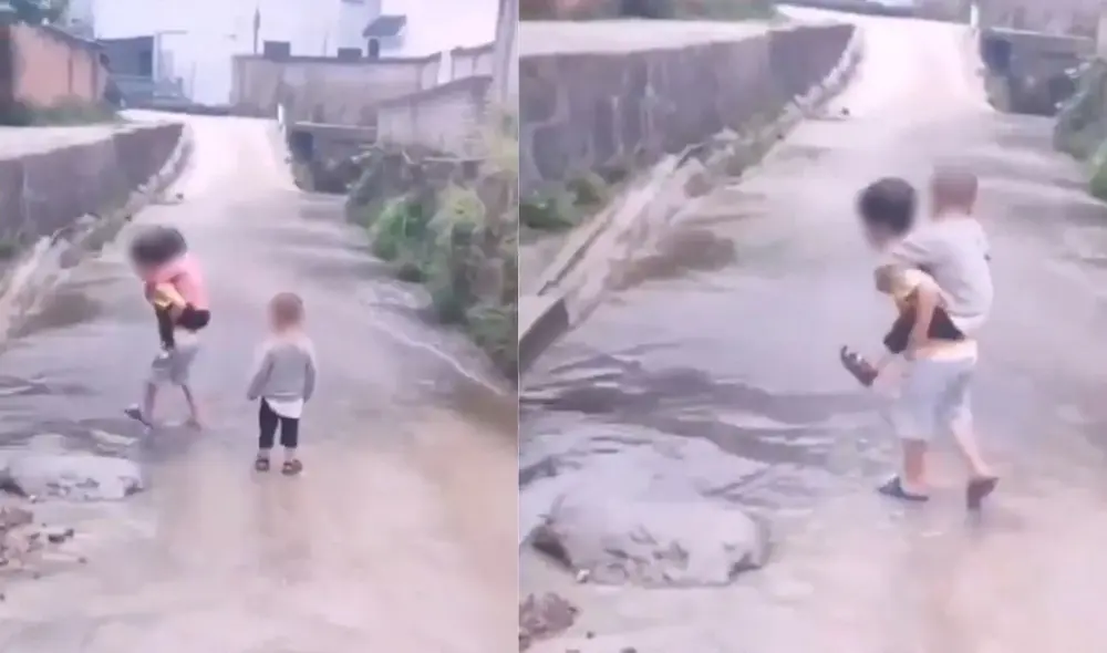 Niño carga a sus hermanitos para que puedan cruzar un charco de agua y no se mojen los pies. Foto: captura de TikTok.