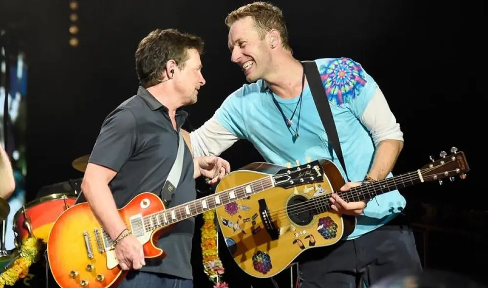 Chris Martin y Michael J. Fox juntos en un concierto de Coldplay en Nueva York. Foto: difusión