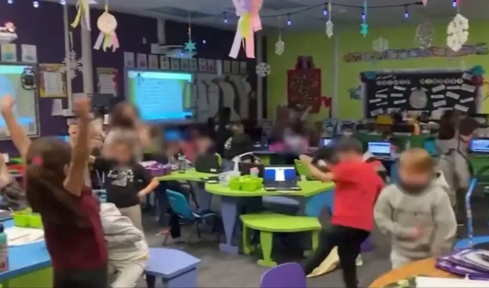 Pequeños estudiantes celebran el fin del uso de mascarillas en la escuela. Foto: captura de YouTube.
