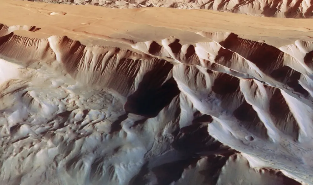 Valles Marineris es el sistema de cañones más grande de Marte y del sistema solar. En la imagen se observa una de sus grietas visto en perspectiva: Tithonium Chasma. Foto: ESA / DLR / FU Berlin