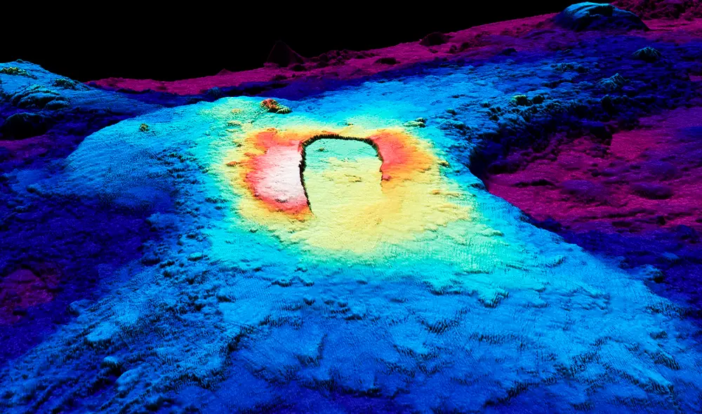 Las zonas de caldera y rift del Axial Seamount frente a la costa de Oregón, representadas como una vista oblicua tridimensional generada por computadora mediante batimetría del fondo marino. Foto: Universidad de Oregón
