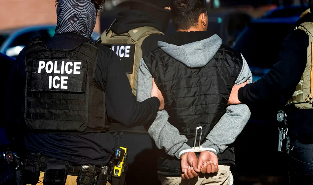 Oficiales de ICE en medio de una redada migratoria en Estados Unidos.