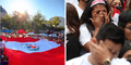 Peruanos alzan bandera peruana gigante y cantan a fuerte voz el himno nacional en EE.UU.