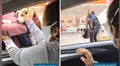 Artista callejero carga a su perro mientras trabaja y joven tiene un noble gesto al darle comida y agua [VIDEO]