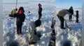 Pequeño captura gigantesco pez en hueco del hielo y se vuelve viral en redes sociales