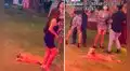 Perrito irrumpe en una fiesta e intenta camuflarse arrastrándose para alcanzar la comida