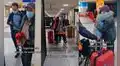 Adulto mayor acude a recoger a su esposa al aeropuerto y la espera con un ramo de flores