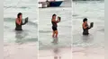 Captan a mujer dentro del mar con su laptop y usuarios bromean: “De vacaciones, pero responsable"