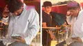 Hombre en estado de ebriedad confunde un vaso lleno de cerveza con su celular