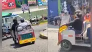 Pareja es captada en pleno tráfico de Lima utilizando un auto miniatura