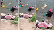 Perrito aprovecha que su dueña lava ropa en la orilla para darse un chapuzón en el río