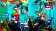 Payasito cae encima de mesa decorada y tira el pastel cuando repartía juguetes de la piñata