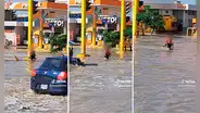 ¡No lo abandonó! Niño carga a su perrito para cruzar vía inundada por intensas lluvias