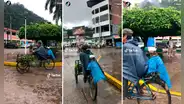 ¡Protegió a su amigo fiel! Hombre coloca una bolsa a su perrito para evitar que se moje con la lluvia