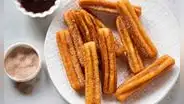 ¿De dónde provienen los populares churros y dónde puedes comerlos en Lima?