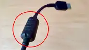 ¿Para qué sirve el 'cilindro' que llevan la mayoría de cables de carga? Descubre por qué es importante su función