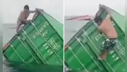 Pescador en Callao se sube a contenedor que cayó al mar peruano para sacar artículos y en redes dicen: "Quería saber qué venía en las cajas"