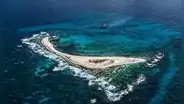 La isla que se hunde bajo el mar en el Caribe y permite a este país de América Latina reclamar miles de kilómetros de océano