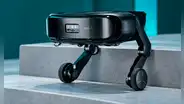 China muestra un robot aspirador que sube y limpia escaleras por sí solo: combina ruedas y patas articuladas para superar obstáculos