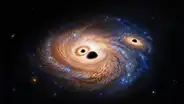 Tres agujeros negros gigantes fueron descubiertos en una galaxia del amanecer de los tiempos
