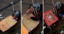 ¿Control de calidad? Repartidor de pizza es captado comiendo tajada y la oculta de curiosa manera