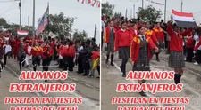 Delegación de alumnos extranjeros se hace presente en desfile escolar y son la sensación en redes: "Los queremos mucho"
