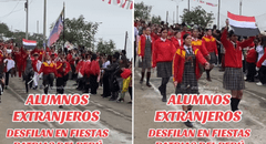 Delegación de alumnos extranjeros se hace presente en desfile escolar y son la sensación en redes: "Los queremos mucho"