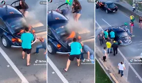 La unión hace la fuerza: ayudan a chofer a apagar su Volkswagen que se incendiaba en una avenida