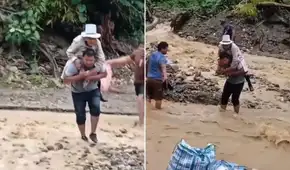 Adulta mayor es cargada para poder cruzar quebrada activa: lluvias intensas causan desborde de ríos en Madre de Dios
