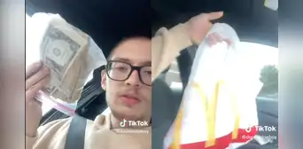 Joven hizo pedido en restaurante de comida rápida y recibe por error US$5.000 en la bolsa Joven hizo pedido en restaurante de comida rápida y recibe por error US$5.000 en la bolsa