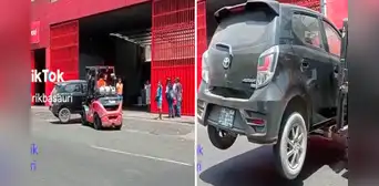 Deja su auto estacionado en la puerta de un almacén y trabajadores lo retiran con un montacarga Deja su auto estacionado en la puerta de un almacén y trabajadores lo retiran con un montacarga