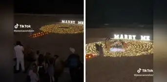 Joven le pide matrimonio a su novia en la playa, pero se le cae el anillo en la arena