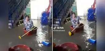 "Reír para no llorar": peruana se mete a una tina y navega en su vivienda inundada