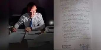 Juez redacta a mano una resolución de medidas de protección por falta de luz