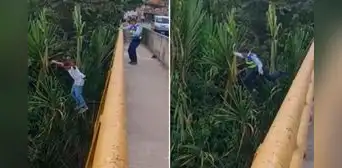 Conductor se lanza a un río para no ser multado por policía y este se tira a perseguirlo