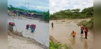 Piuranos se arriesgan y cruzan caudaloso río para rescatar cervezas, papas y otros productos Piuranos se arriesgan y cruzan caudaloso río para rescatar cervezas, papas y otros productos