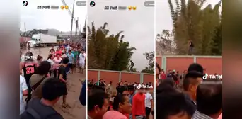 ¡Solo en Perú! Joven camina por el borde de una pared para evitar mojarse durante inundación ¡Solo en Perú! Joven camina por el borde de una pared para evitar mojarse durante inundación