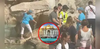 Turista sube a la Fontana di Trevi para llenar su botella de agua y causa furor en redes Turista sube a la Fontana di Trevi para llenar su botella de agua y causa furor en redes