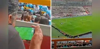 Hincha se sienta en una tribuna del Estadio Nacional para disfrutar del Cristal vs. Palmeiras, pero sigue el partido en su celular Hincha se sienta en una tribuna del Estadio Nacional para disfrutar del Cristal vs. Palmeiras, pero sigue el partido en su celular