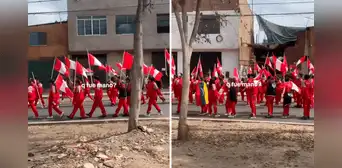 Peruano graba desfile por Fiestas Patrias y nota a escolar llevando bandera de Venezuela Peruano graba desfile por Fiestas Patrias y nota a escolar llevando bandera de Venezuela