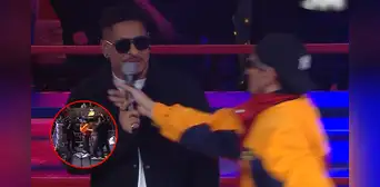 Sujeto irrumpe en el ring de 'La Noche Dorada' 2025 y le arrebata el micrófono al presentador para cantar su canción: fue detenido a los pocos segundos Sujeto irrumpe en el ring de 'La Noche Dorada' 2025 y le arrebata el micrófono al presentador para cantar su canción: fue detenido a los pocos segundos