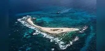 La isla que se hunde bajo el mar en el Caribe y permite a este país de América Latina reclamar miles de kilómetros de océano