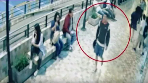 Sujeto que aún falta detener es captado siguiendo los pasos de Joelbi Liendo para ingresar al McDonald's y cometer el crimen . (Foto: Captura de video / Latina Noticias) videos previos crimen risso