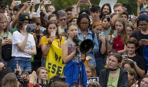 Swedish environment activist Greta Thunberg speaks at a climate protest outside the White House in Washington, DC on September 13, 2019. - Thunberg, 16, has spurred teenagers and students around the world to strike from school every Friday under the rallying cry "Fridays for future" to call on adults to act now to save the planet. (Photo by Alastair Pike / AFP) Greta Thunberg