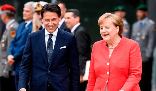 Giussepe Conte, primer ministro de Italia, y Angela Merkel, canciller alemana, durante la cumbre de migrantes de 2018. (Foto: The Times)