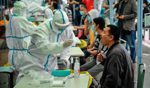 El último sábado, la ciudad china registró 37 infecciones locales de coronavirus. Foto: AFP El último sábado, la ciudad china registró 37 infecciones locales de coronavirus. Foto: AFP