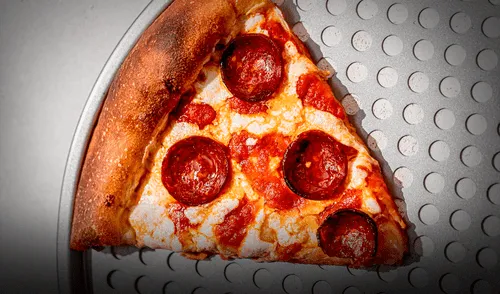 Nueva York, a través de una cadena  de restaurantes, ofrece la promoción de rebanadas de  pizzas a 1 dólar. Foto: Baker's Secret